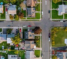 An aerial view of a suburban street.