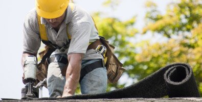 man working on roof